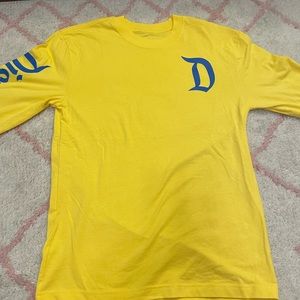 Disneyland yellow long sleeve top, size small. Brand new.
